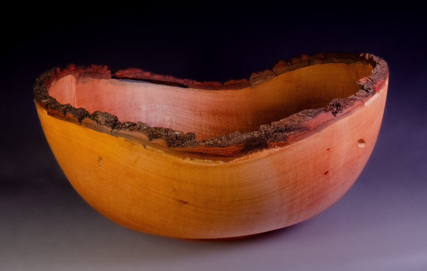 Maple bowl with feathering and natural edge