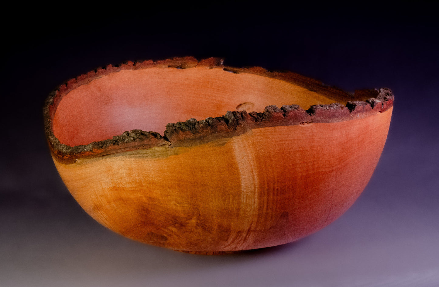 Maple bowl with feathering and natural edge