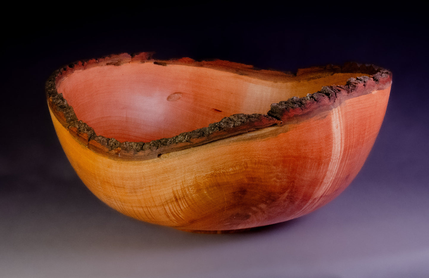 Maple bowl with feathering and natural edge
