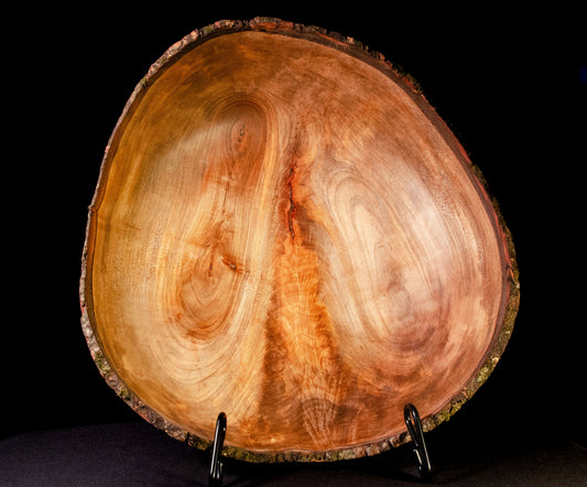 Shallow bowl with natural edge and striking crotch figure.  Exquisite display, gift, or centerpiece.
