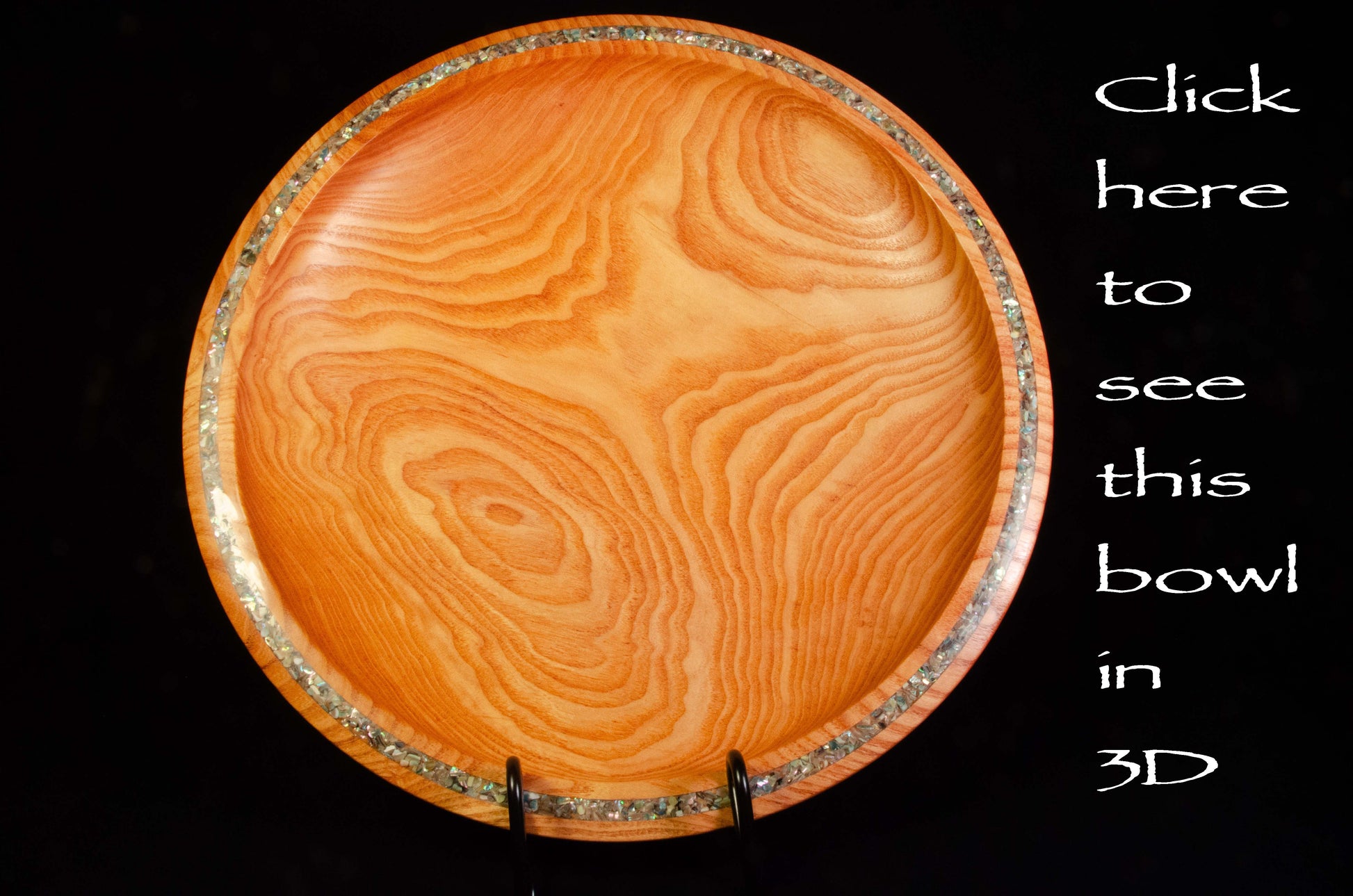 Honey Locust Platter. Dramatic edge feature with abalone shell adds sparkle to a strongly figured platter.
