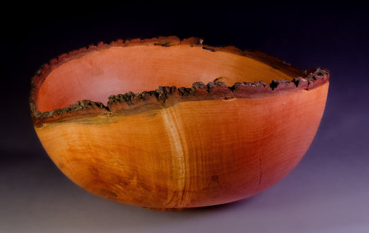 Maple bowl with feathering and natural edge