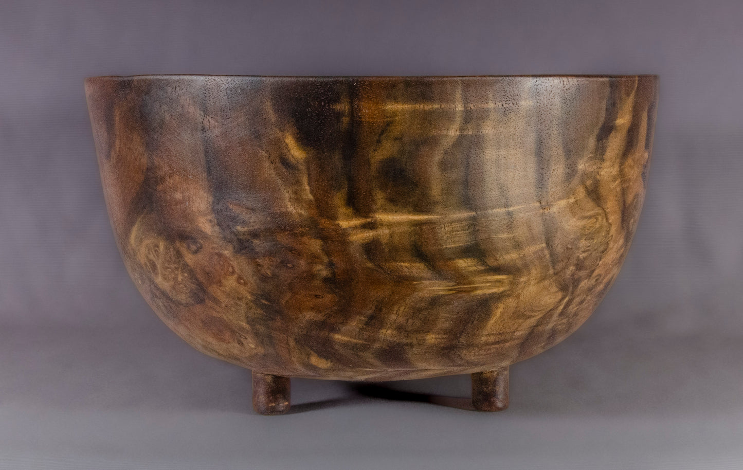 Claro Walnut bowl with carved feet