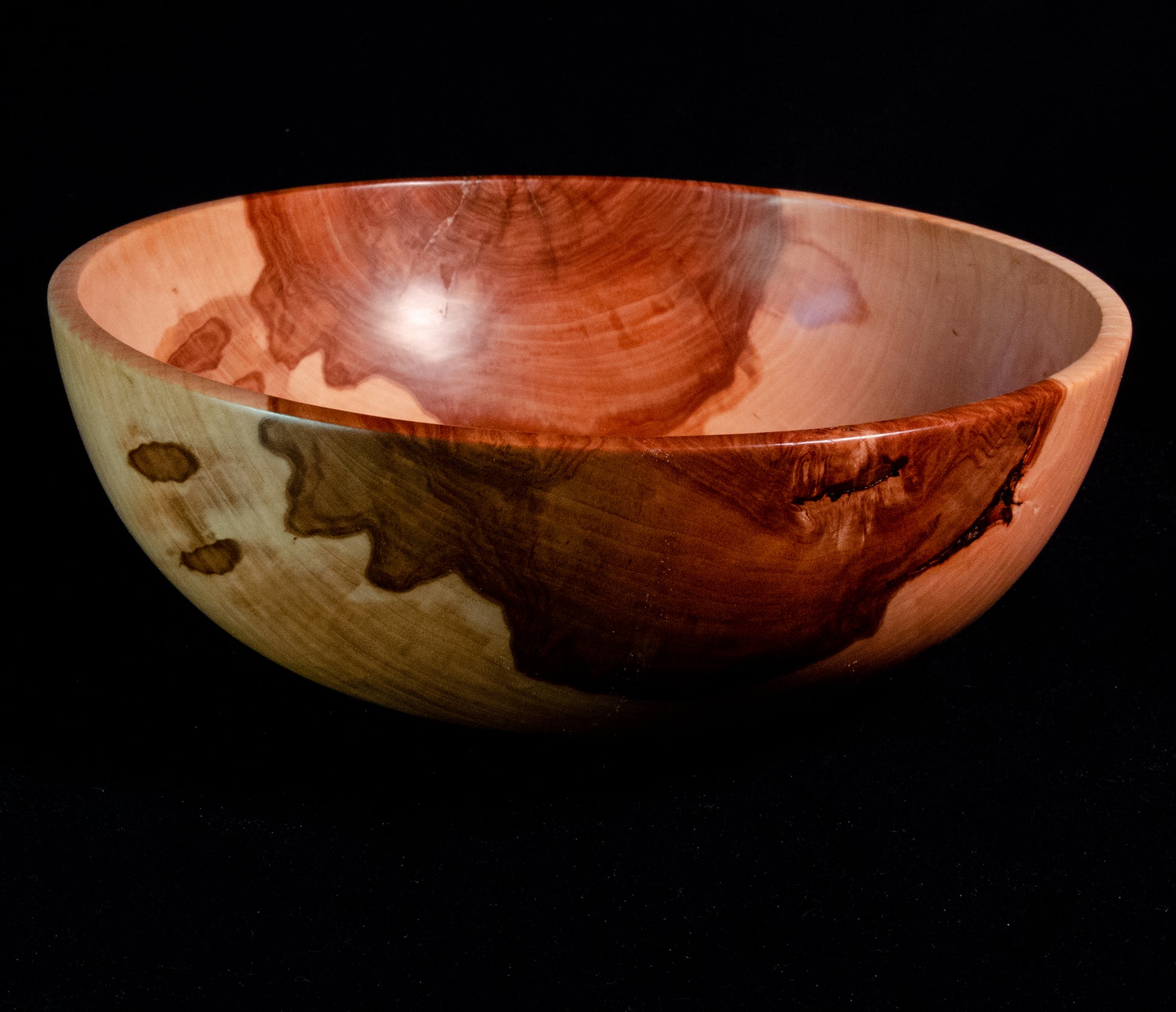 Medium aapple wood bowl with quilting pattern to the grain.  