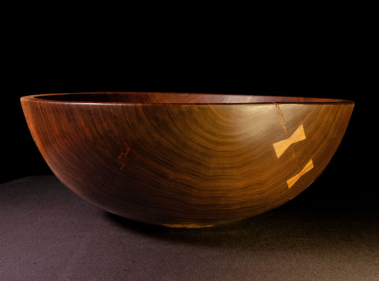 Black walnut bowl with rich grain structure and tonality. Crack on one side mended with bowties. Beautiful sald, fruit or popcorn bowl. Makes a wonderful gift for home, wedding, or occasion.